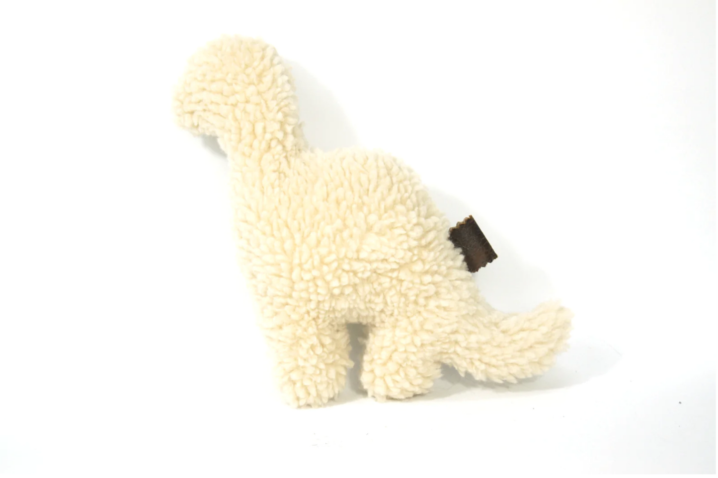 Cuddly woolen dinosaur toy